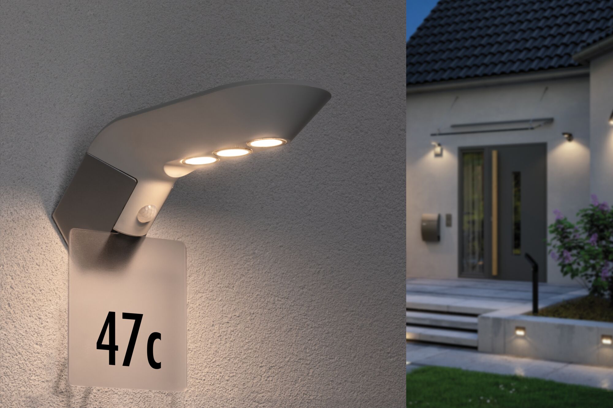 Moderne graue Außenwandleuchte mit LED und Hausnummernschild beleuchtet Eingangsbereich bei Dämmerung