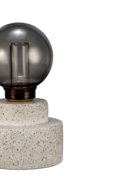 Modern table lamp with grey concrete base and smoked glass bulb for stylish room lighting