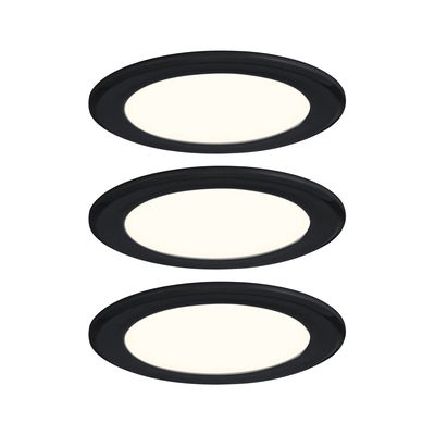 Three round LED recessed lights with black frame and warm white light for modern indoor lighting