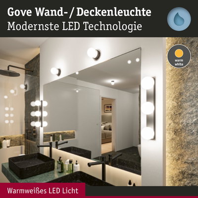 Gove Wand- und Deckenleuchte mit warmweißem LED-Licht in modernem Badezimmer mit Spiegel.