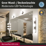 Gove Wand- und Deckenleuchte mit warmweißem LED-Licht in modernem Badezimmer mit Spiegel.
