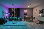 Modern living room with color-changing black and white LED ceiling lights, stylish ambient lighting