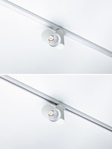Modern white metal LED spotlight on track system for flexible room lighting solutions