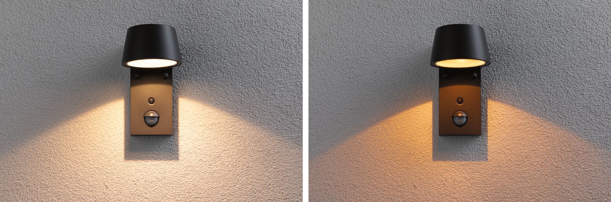 Black metal outdoor wall light with motion sensor and warm white light on grey textured wall