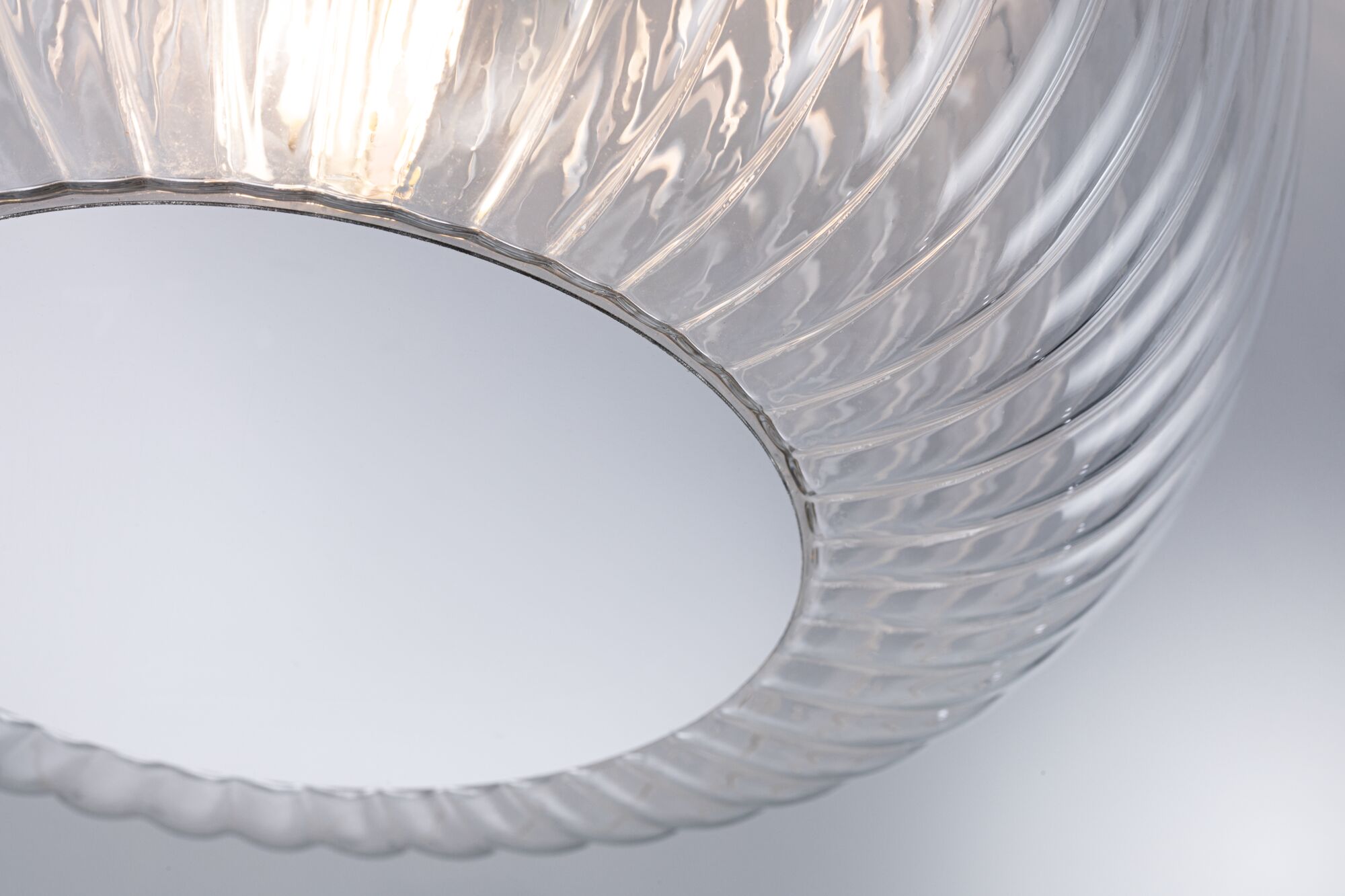 Round ceiling light with transparent ribbed glass and white diffuser for modern ambient lighting