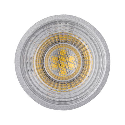 Close-up of LED lamp with silver aluminum housing and yellow LED chips for energy-efficient lighting