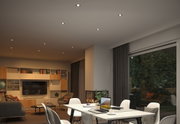Modern living room with white LED recessed ceiling lights and cozy furniture including a fireplace.