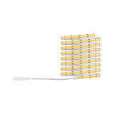 Flexible LED strip with white and yellow diodes and white connector cable for lighting decoration.