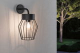 Black metal outdoor wall light with cage design and visible bulb for garden lighting