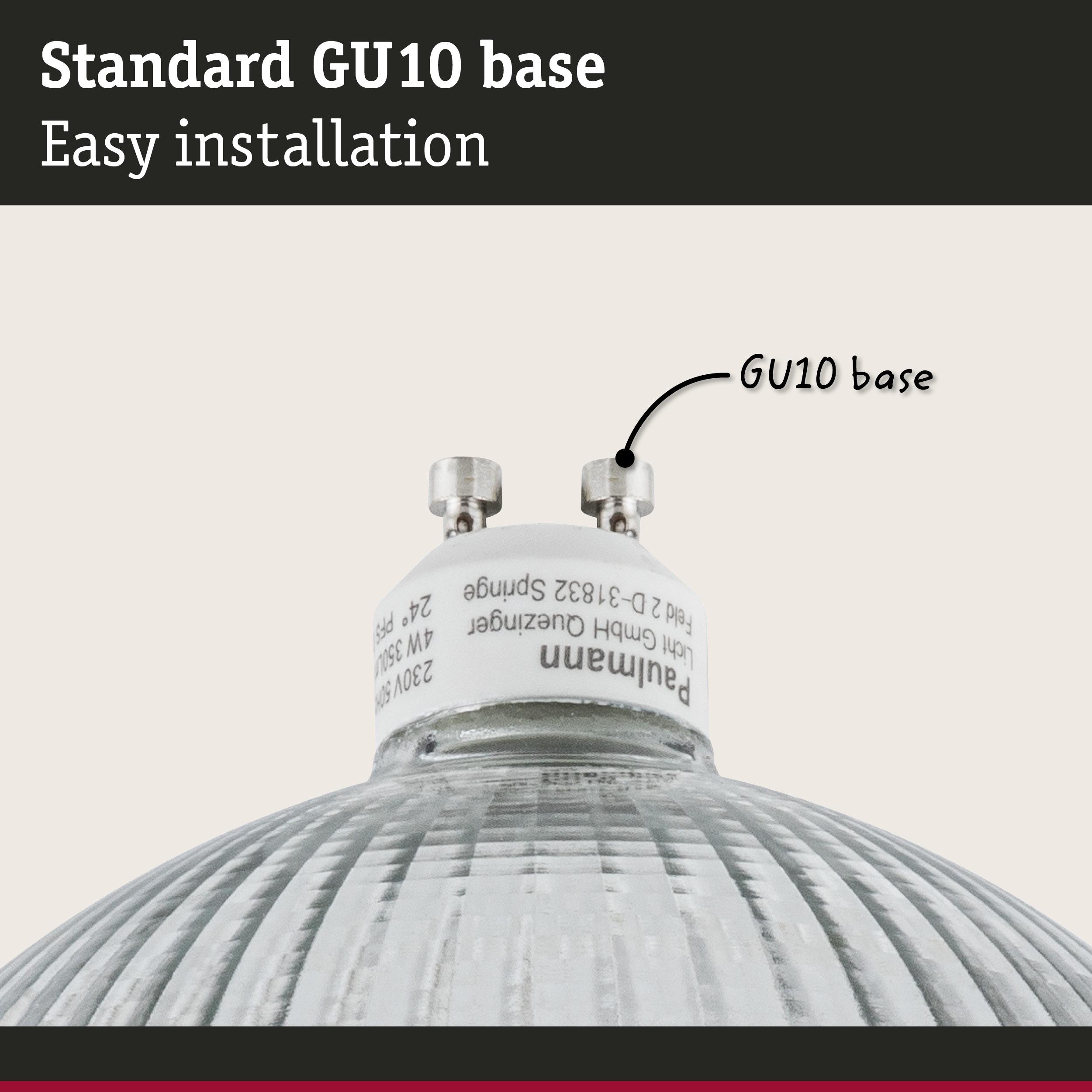 Close-up of a white GU10 base lamp holder with glass reflector for LED bulbs