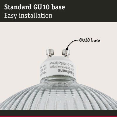 Close-up of a white GU10 base lamp holder with glass reflector for LED bulbs