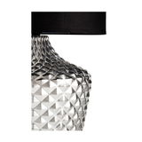 Table lamp with clear textured glass base and black fabric shade for elegant lighting