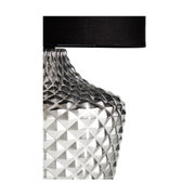Table lamp with clear textured glass base and black fabric shade for elegant lighting