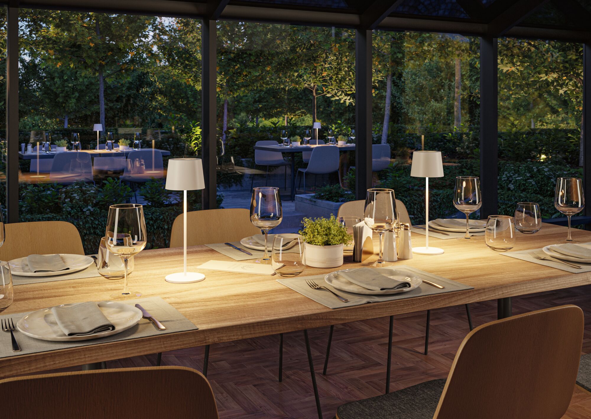 Modern wooden dining table with white LED table lamps and elegantly set dishes in dining room.