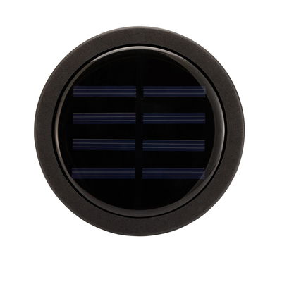 Rundt sort solpanel med glasdæksel og mat ramme til bæredygtig energiproduktion