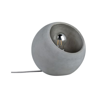 Round table lamp made of grey concrete with visible LED bulb and fabric cable for modern lighting