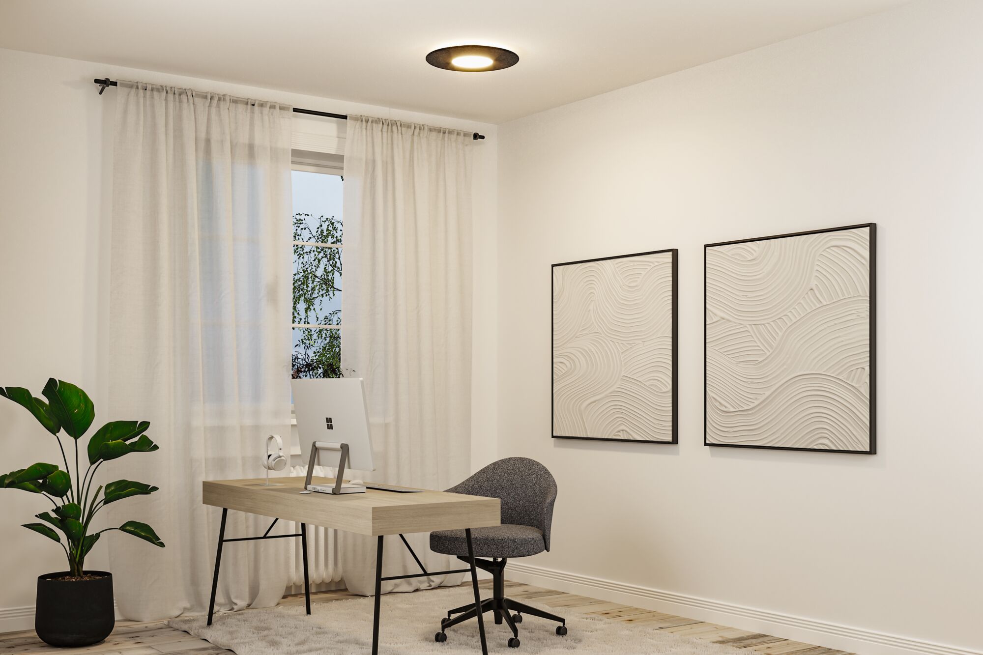Modern home office with black metal ceiling light featuring warm white LED illumination.