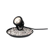 Black LED outdoor spotlight with adjustable head on gravel in round base for garden lighting