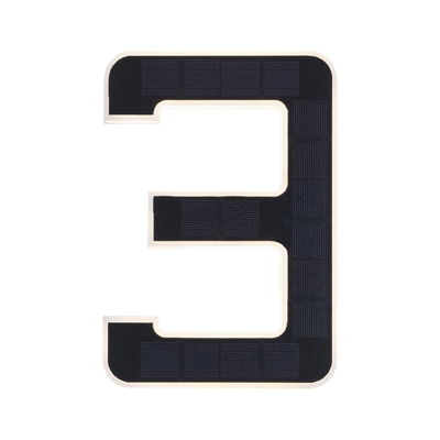 Number 3 house sign with black solar panels and white frame for energy-saving outdoor lighting