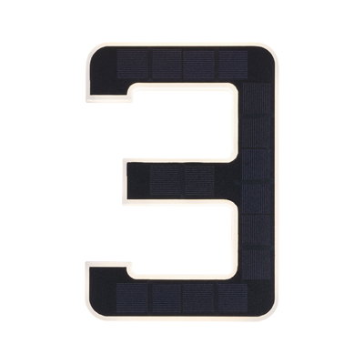 Solar-powered house number 3 in black with white border for outdoor lighting use