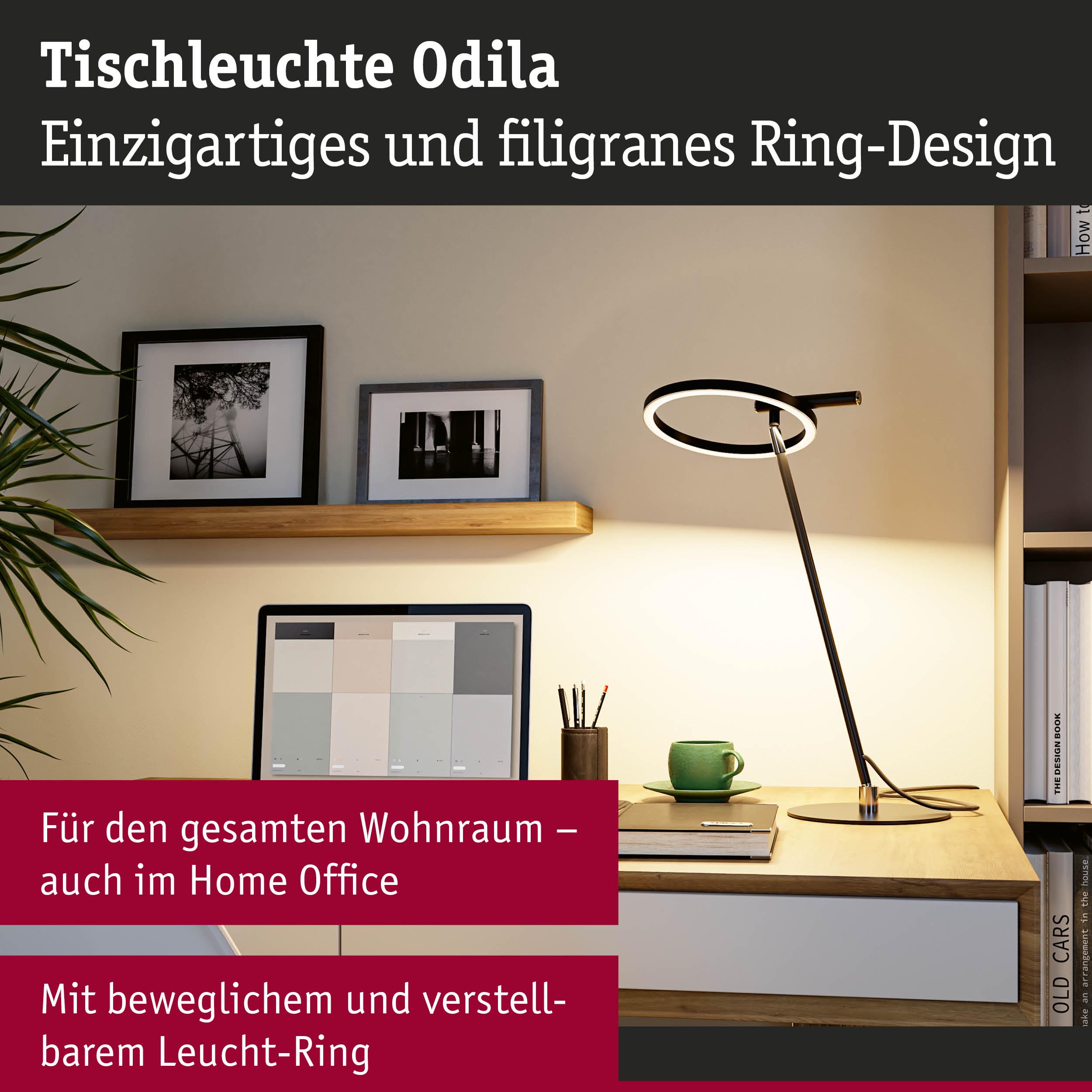 Moderne Tischleuchte Odila in Schwarz mit beweglichem Leuchtring auf Holzschreibtisch im Home Office