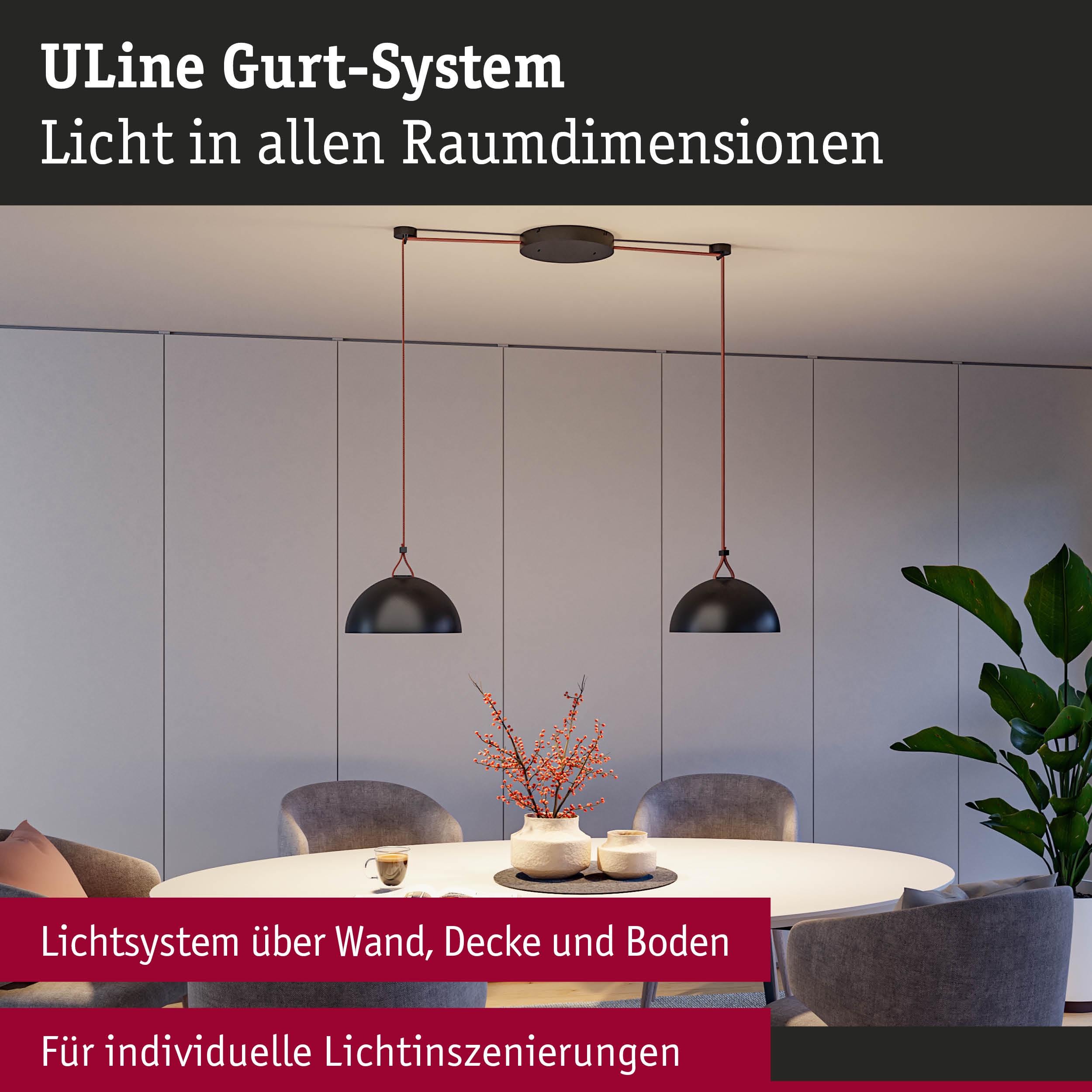 Modernes ULine Gurt-System mit schwarzen Hängeleuchten über rundem Tisch in hellem Raum