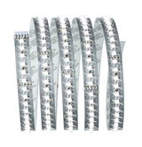Flexible LED strip with white LEDs on silver circuit board for modern lighting applications