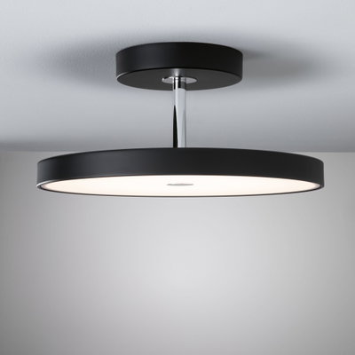 Modern black ceiling light with round design and white plastic diffuser for living spaces