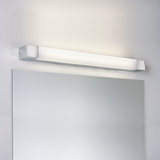 Modern chrome LED wall light with opal diffuser above bathroom mirror for bright room lighting