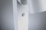 Close-up of white LED spotlight with built-in motion sensor made of plastic for indoor lighting