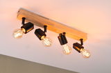 Ceiling spotlight with four black metal lamps on wooden bar, warm white LED light for living space.