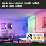 Modern living room with smart LED lights in colorful hues, controllable via app, voice or remote control