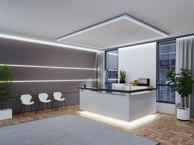 Bureau moderne avec comptoir d'accueil blanc et bandes LED au mur et plafond pour un éclairage lumineux