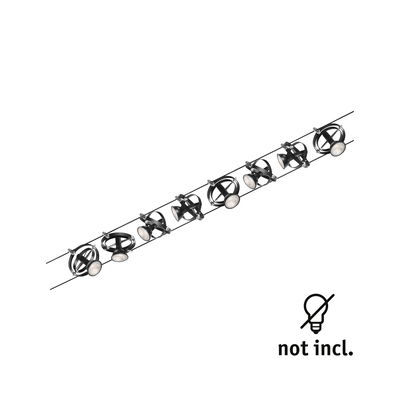 Black cable lighting system with adjustable metal LED spotlights for versatile room illumination