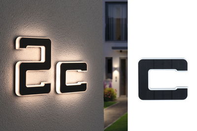 Lumière LED noire pour numéro de maison avec éclairage blanc chaud et design moderne extérieur.