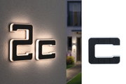 Modernes schwarzes LED-Hausnummernschild mit weißer Umrandung und Solarzellen für Außenbeleuchtung