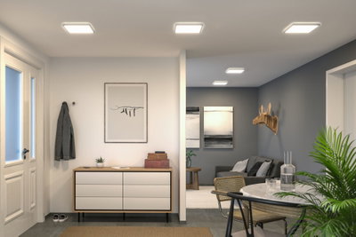 Modern living room with white square plastic ceiling lights providing energy-efficient LED lighting