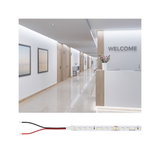LED strip light with white LEDs and black and red wires for versatile lighting solutions