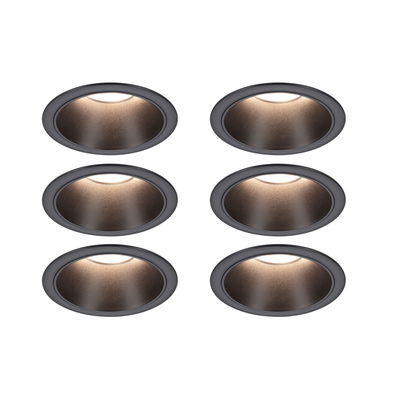 Set of six matte black recessed spotlights with warm white light for modern indoor lighting