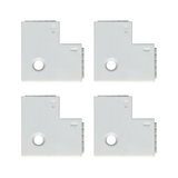 Four white plastic corner connectors with arrows and hole for LED track lighting system.