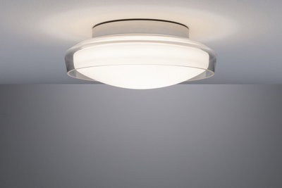 Plafonnier discret en verre blanc avec bord transparent pour un éclairage moderne.