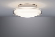 Plafonnier discret en verre blanc avec bord transparent pour un éclairage moderne.