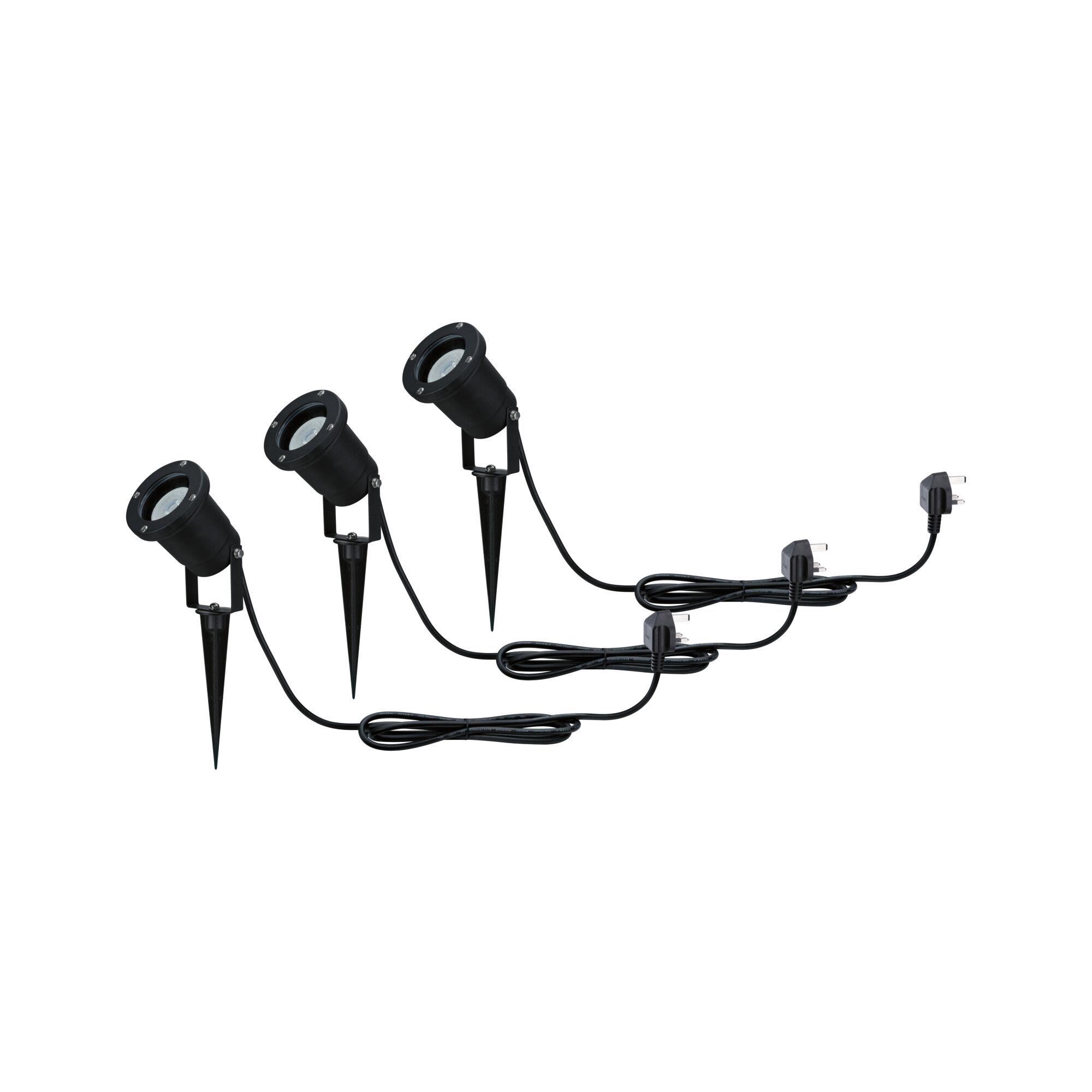 Three black LED garden spotlights with ground spikes and cables for outdoor garden lighting.