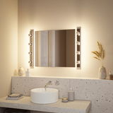 Modern bathroom with round white ceramic sink and illuminated mirror featuring LED lights.