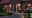 Outdoor insect-friendly lighting on red brick house and garden path at dusk for sustainable garden illumination