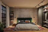 Modern bedroom with green fabric headboard, concrete wall, and black LED track lighting