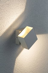 Modern white metal LED wall spotlight with warm white light for outdoor use