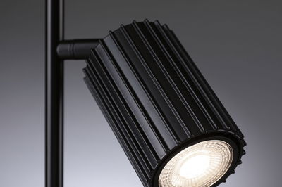 Black aluminium LED spotlight with ribbed housing for modern indoor lighting solutions
