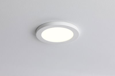 Round white LED ceiling light with matte frame for modern indoor lighting and energy-saving illumination