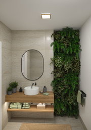 Salle de bain moderne avec meuble en bois, miroir rond et mur végétal vert pour une ambiance lumineuse naturelle